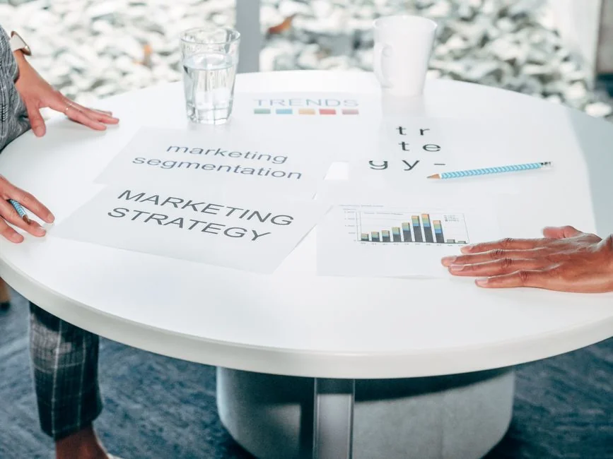 Man analyzing marketing content strategies using sticky notes on a whiteboard.